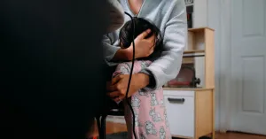 A mother hugs their child after setting boundaries with them